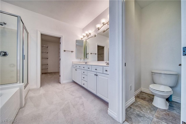 3891 Sedgwick, Pahrump, NV 89061 - full bathroom featuring a walk in closet, toilet, baseboards, a stall shower, and double vanity