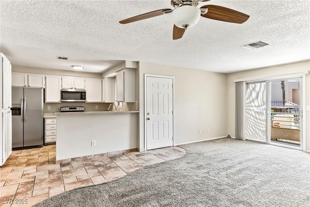 kitchen featuring light countertops, visible vents, appliances with stainless steel finishes, and ceiling fan
