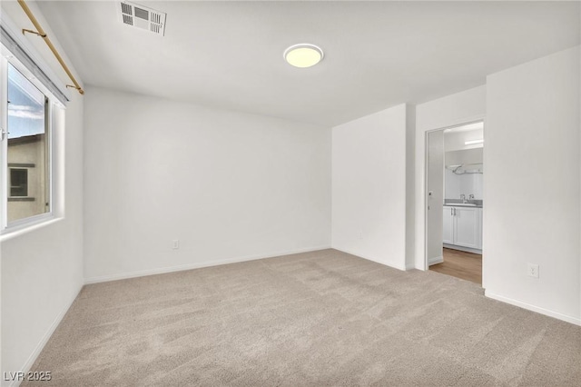 6952 Crimson Shadow St, North Las Vegas, NV 89086 - unfurnished room with carpet floors, a sink, and baseboards