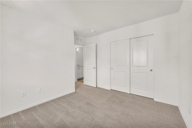 6952 Crimson Shadow St, North Las Vegas, NV 89086 - unfurnished bedroom with carpet floors, baseboards, and a closet