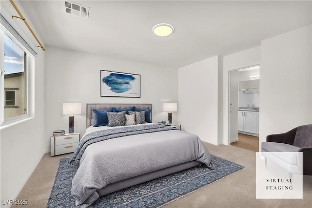 6952 Crimson Shadow St, North Las Vegas, NV 89086 - bedroom with carpet, a sink, baseboards, and ensuite bath