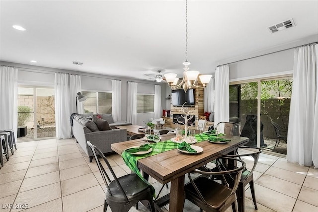 dining room with visible vents, a notable chandelier, and light tile patterned floors