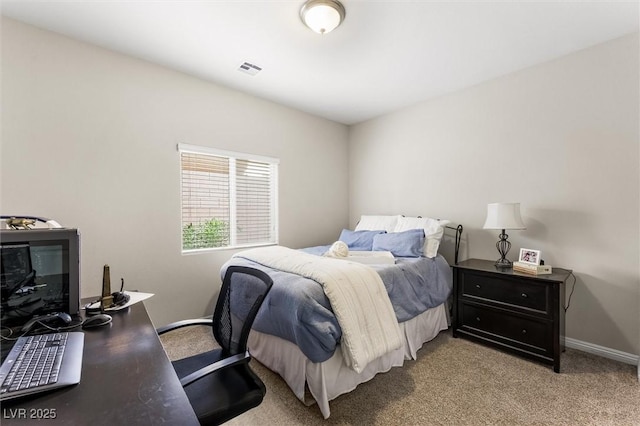 bedroom featuring baseboards, visible vents, and carpet floors