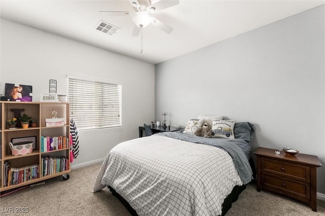 bedroom featuring baseboards, visible vents, carpet flooring, and a ceiling fan