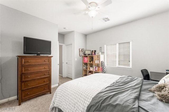 bedroom featuring light carpet, baseboards, ceiling fan, and visible vents