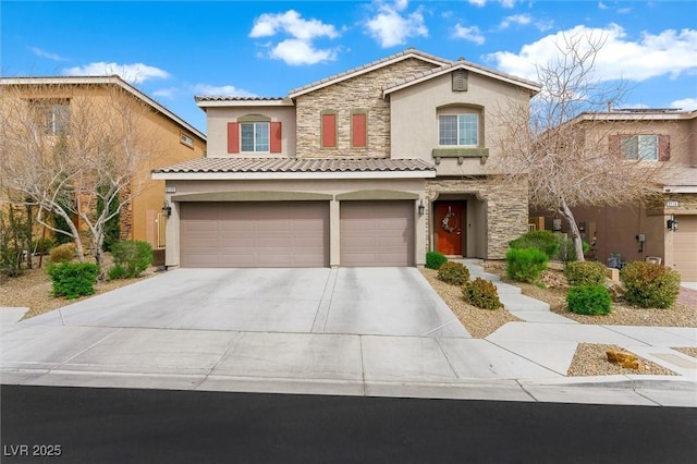 mediterranean / spanish-style house with stucco siding, stone siding, a tiled roof, driveway, and a garage