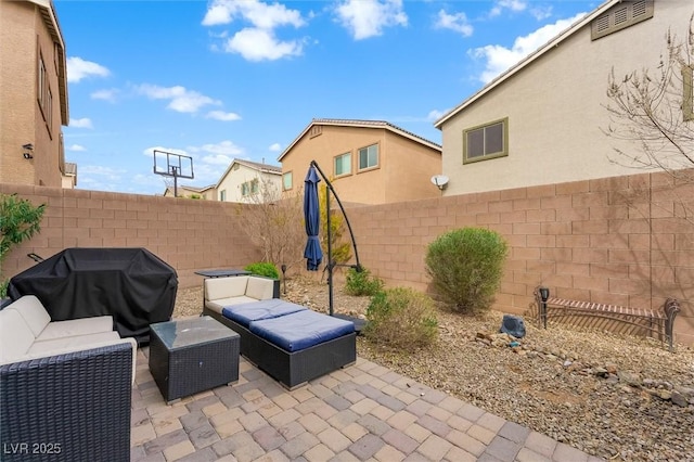 view of patio / terrace with a fenced backyard and area for grilling