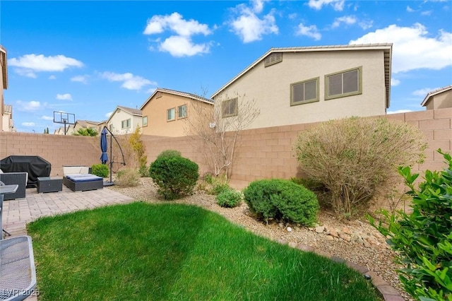 view of yard with a fenced backyard and a patio area