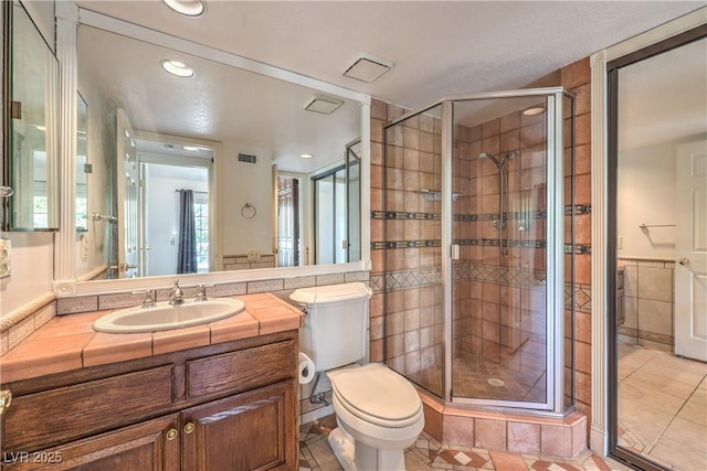 bathroom featuring visible vents, toilet, tile patterned floors, and a shower stall