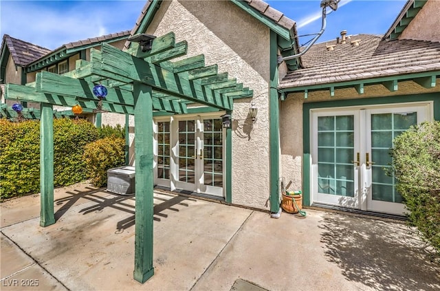 view of patio / terrace with a pergola and french doors