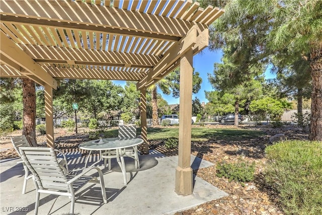 view of patio / terrace with a pergola and outdoor dining area