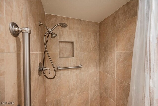 interior details featuring a shower stall
