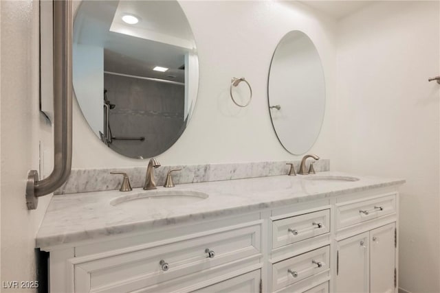 full bath with double vanity and a sink