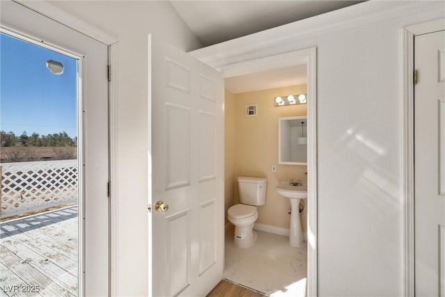 861 Mcmurray Dr, Pahrump, NV 89060 - half bath featuring toilet, baseboards, and visible vents