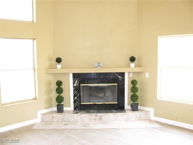 861 Mcmurray Dr, Pahrump, NV 89060 - room details featuring baseboards, a fireplace, and wood finished floors