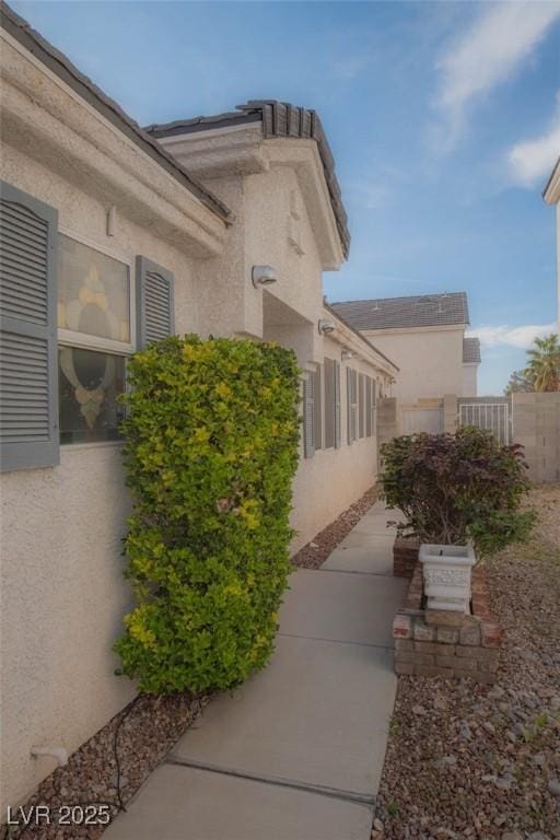 9323 W Rochelle Ave, Las Vegas, NV 89147 - view of home's exterior featuring stucco siding and a patio area