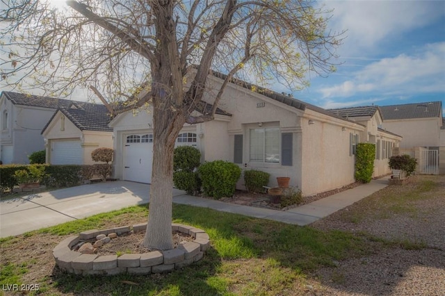9323 W Rochelle Ave, Las Vegas, NV 89147 - view of front of property with stucco siding, an attached garage, and driveway