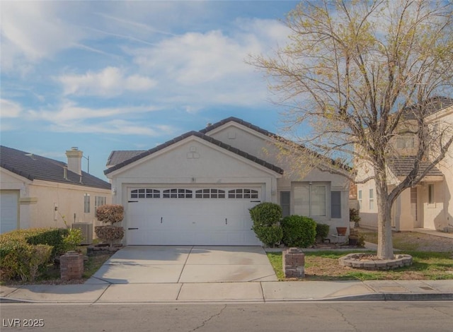 9323 W Rochelle Ave, Las Vegas, NV 89147 - ranch-style house featuring a garage, concrete driveway, and stucco siding