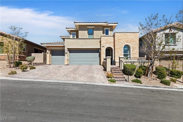 11834 Albissola Ave, Las Vegas, NV 89138 - view of front of house featuring driveway, fence, a tiled roof, an attached garage, and stucco siding