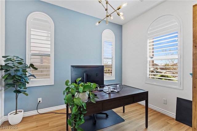 11834 Albissola Ave, Las Vegas, NV 89138 - office area with baseboards, wood finished floors, and a notable chandelier