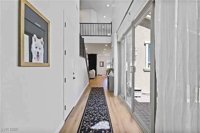 11834 Albissola Ave, Las Vegas, NV 89138 - corridor featuring a high ceiling, light wood-style flooring, baseboards, and recessed lighting