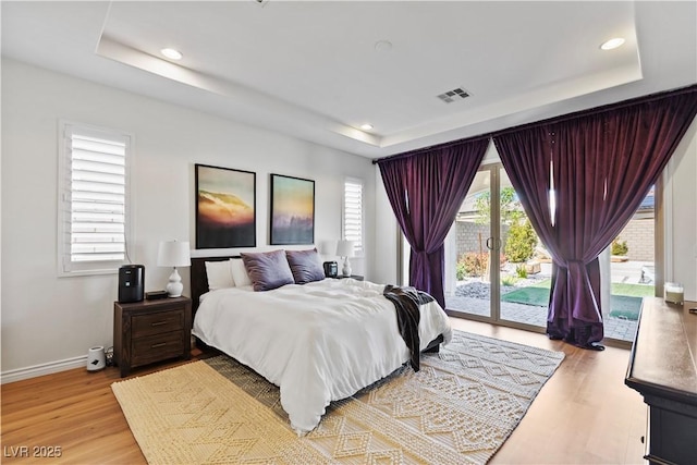 11834 Albissola Ave, Las Vegas, NV 89138 - bedroom featuring access to outside, a tray ceiling, and visible vents