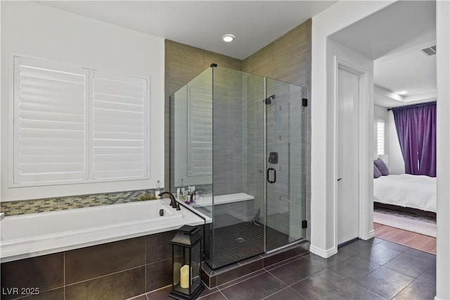 11834 Albissola Ave, Las Vegas, NV 89138 - bathroom featuring tile patterned floors, a stall shower, ensuite bath, a garden tub, and visible vents