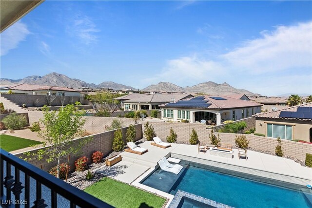 11834 Albissola Ave, Las Vegas, NV 89138 - exterior space with a patio, a mountain view, a fenced backyard, and a pool with connected hot tub