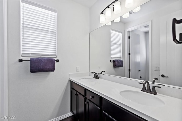 11834 Albissola Ave, Las Vegas, NV 89138 - bathroom featuring baseboards, double vanity, and a sink