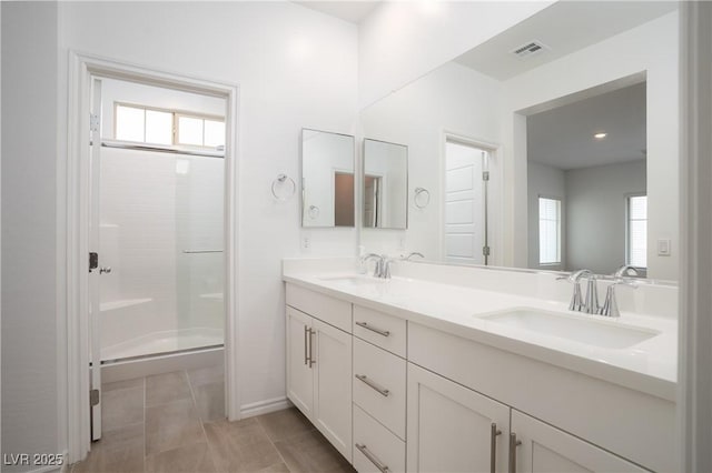 600 N Carriage Hill Dr Unit 2174, Las Vegas, NV 89138 - full bath featuring plenty of natural light, a stall shower, double vanity, and tile patterned flooring