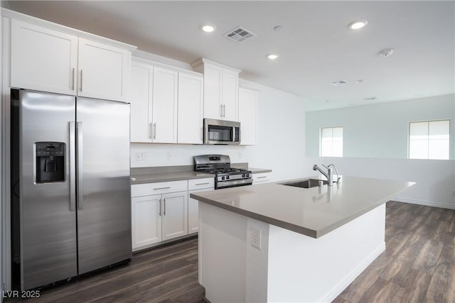 600 N Carriage Hill Dr Unit 2174, Las Vegas, NV 89138 - kitchen featuring appliances with stainless steel finishes, an island with sink, dark wood finished floors, a sink, and white cabinets