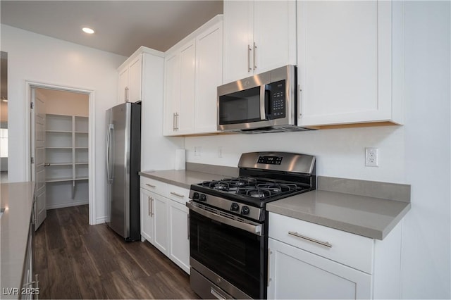 600 N Carriage Hill Dr Unit 2174, Las Vegas, NV 89138 - kitchen featuring appliances with stainless steel finishes, dark wood-style floors, white cabinetry, and recessed lighting