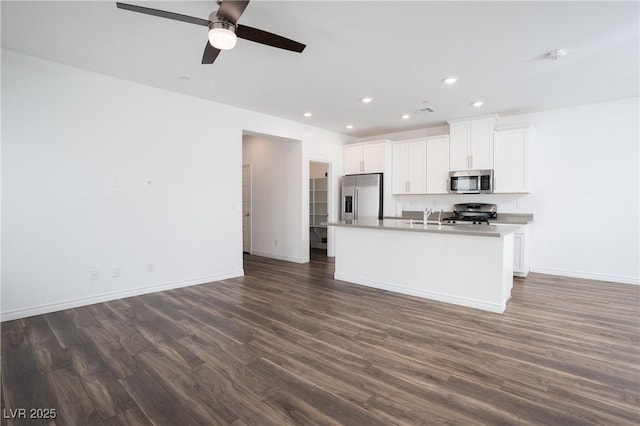 600 N Carriage Hill Dr Unit 2174, Las Vegas, NV 89138 - kitchen featuring stainless steel appliances, a sink, baseboards, dark wood-style flooring, and ceiling fan