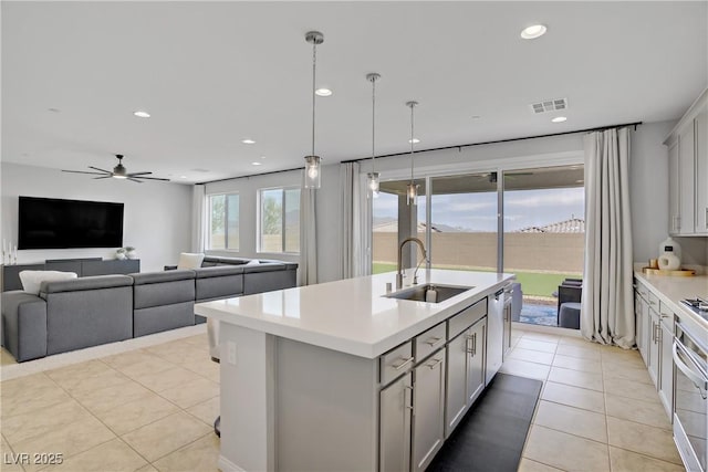 8564 Scalpay St, Las Vegas, NV 89166 - kitchen with a sink, light countertops, gray cabinetry, ceiling fan, and recessed lighting