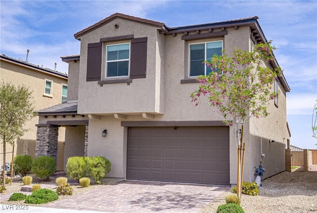 8564 Scalpay St, Las Vegas, NV 89166 - view of front facade with stucco siding, a garage, a tiled roof, and driveway