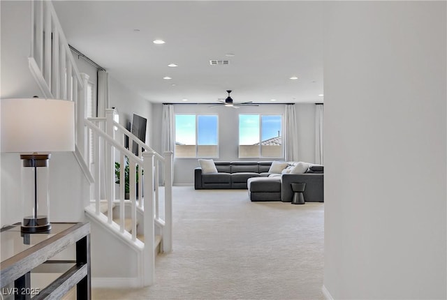 8564 Scalpay St, Las Vegas, NV 89166 - carpeted living room with stairway, a ceiling fan, baseboards, and recessed lighting