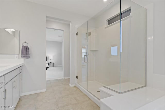 8564 Scalpay St, Las Vegas, NV 89166 - full bath featuring vanity, a stall shower, baseboards, and tile patterned flooring