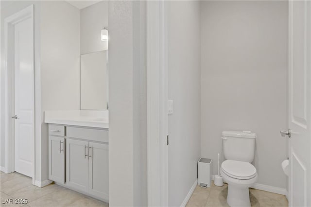 8564 Scalpay St, Las Vegas, NV 89166 - bathroom featuring vanity, toilet, tile patterned floors, and baseboards