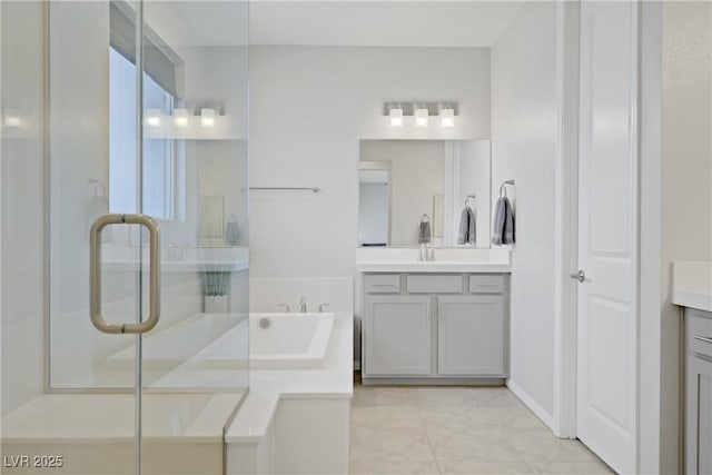 8564 Scalpay St, Las Vegas, NV 89166 - bathroom featuring vanity, a bath, a shower stall, and tile patterned flooring