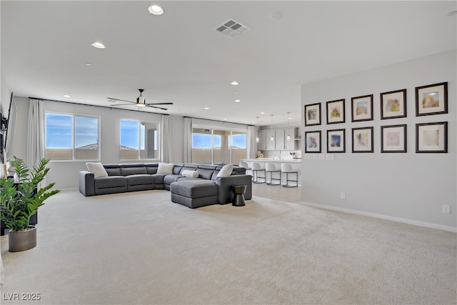 8564 Scalpay St, Las Vegas, NV 89166 - living room featuring light carpet, recessed lighting, baseboards, and ceiling fan