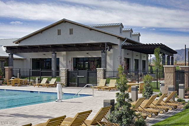 8564 Scalpay St, Las Vegas, NV 89166 - back of property with a community pool, a pergola, a patio, and stone siding