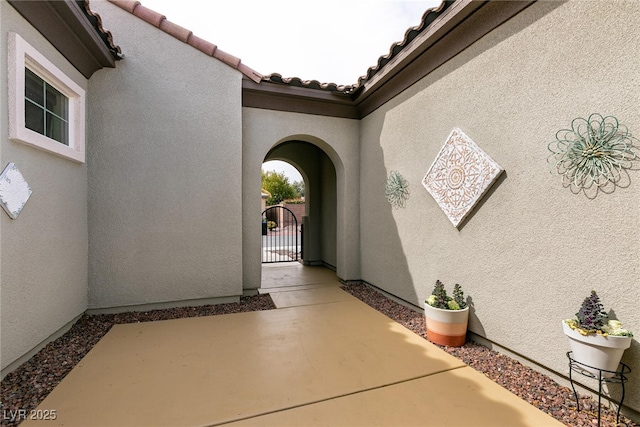 3920 Eiderdown Pl, North Las Vegas, NV 89084 - entrance to property with a gate, stucco siding, a patio, and a tile roof