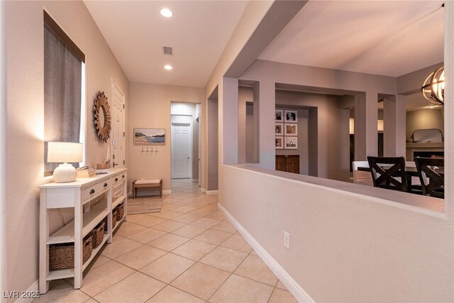 3920 Eiderdown Pl, North Las Vegas, NV 89084 - hall with light tile patterned flooring, recessed lighting, baseboards, and a chandelier
