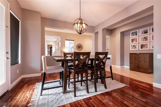 3920 Eiderdown Pl, North Las Vegas, NV 89084 - dining area featuring hardwood / wood-style floors, a chandelier, and baseboards