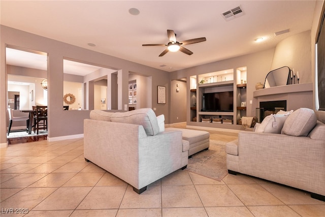 3920 Eiderdown Pl, North Las Vegas, NV 89084 - living room with ceiling fan, light tile patterned floors, and baseboards