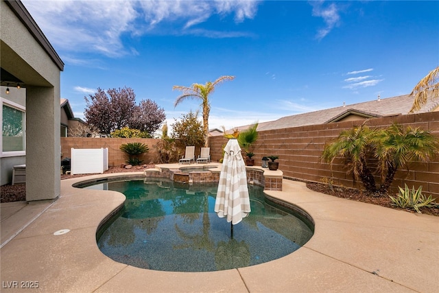 3920 Eiderdown Pl, North Las Vegas, NV 89084 - view of pool featuring a pool with connected hot tub, a patio, and a fenced backyard