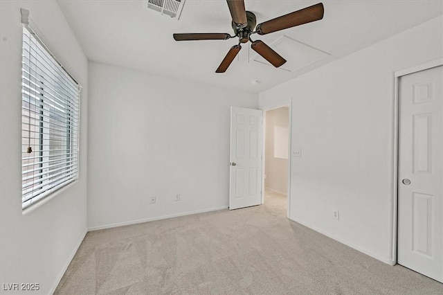 unfurnished bedroom featuring visible vents, a ceiling fan, carpet flooring, and baseboards
