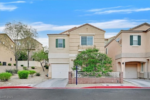 traditional home with driveway, a garage, stucco siding, and fence