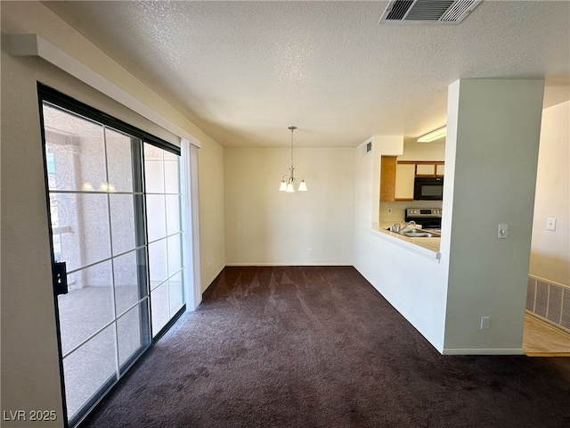 unfurnished dining area featuring dark colored carpet, visible vents, a textured ceiling, and a notable chandelier