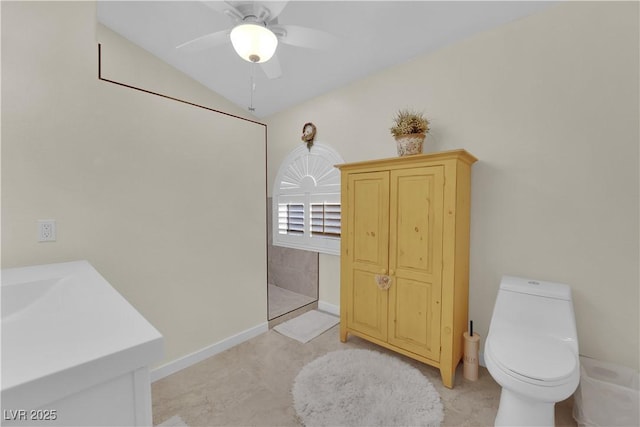7405 Blue Sage Ct, Las Vegas, NV 89129 - bathroom featuring vanity, vaulted ceiling, and a ceiling fan